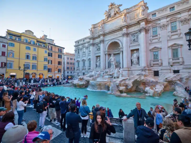 Mass of tourists at the Trevi Fountain, the historic center of the city of Rome in Italy.