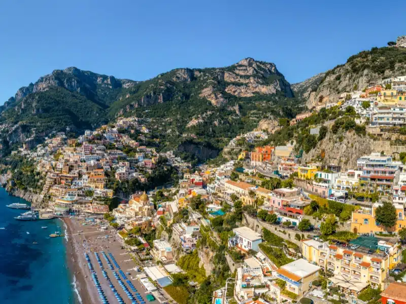 Aerial view of Positano with comfortable beach and blue sea on Amalfi Coast in Campania, Italy. Positano village on the Amalfi Coast, Salerno, Campania. Beautiful Positano, Amalfi Coast in Campania.