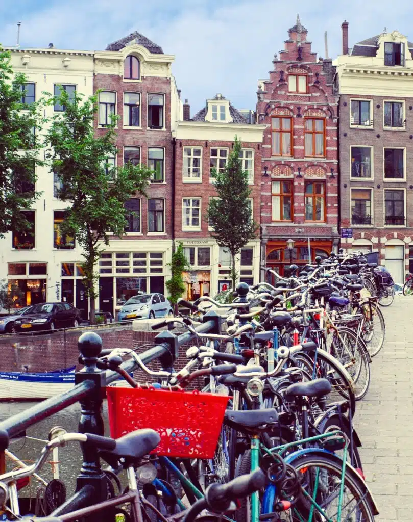 Bikes parked on a bridge in Amsterdam at summer Netherlands