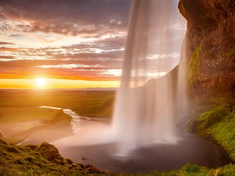 Seljalandsfoss is one of the most beautiful waterfalls on the Iceland. It is located on the South of the island. This photo is taken during the incredible sunset at approx. 1 AM.