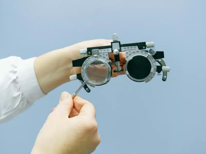 person holding optometrist equipment