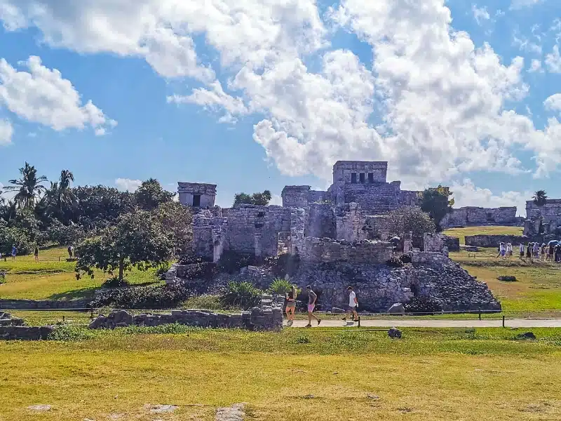 Ancient Tulum ruins Mayan site with temple ruins pyramids and artifacts in the tropical natural jungle forest palm and seascape panorama view in Tulum Mexico.