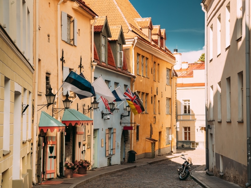 a narrow cobblestone street in a european city