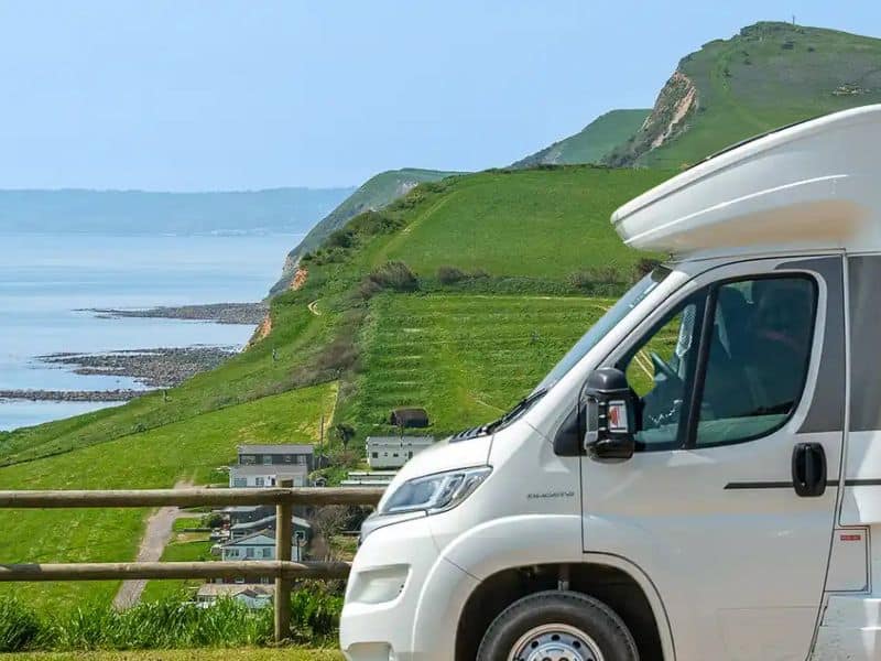 White motorhome parking on a headland in Dorset