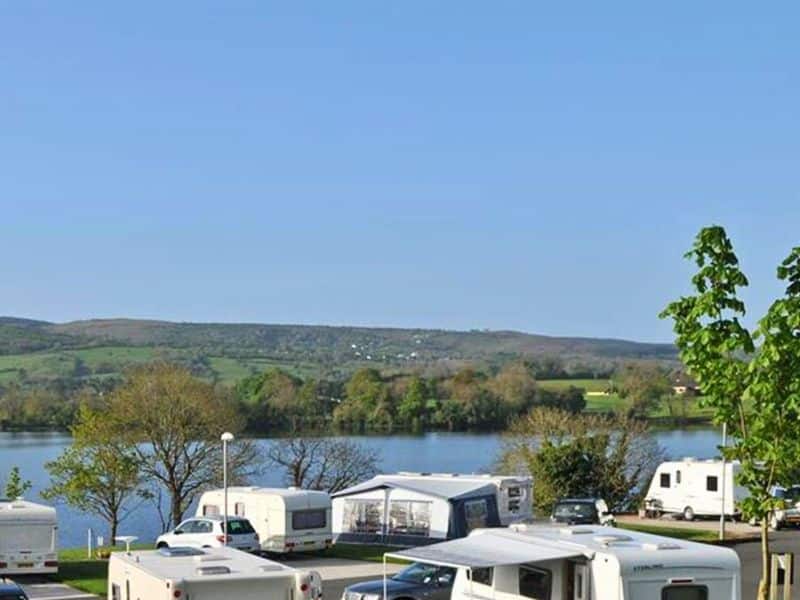 Motorhomes and caravans on the banks of a lough
