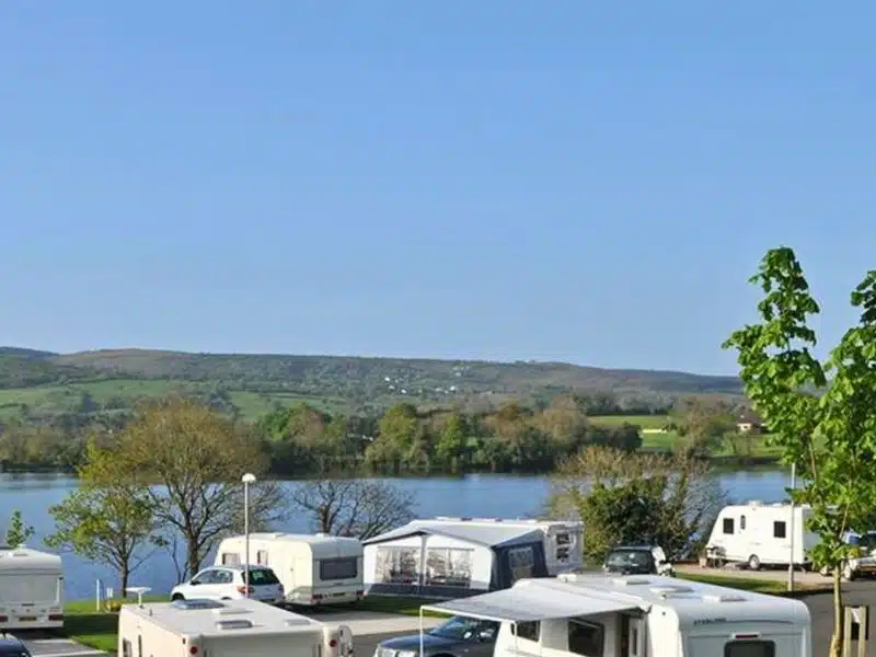 Motorhomes and caravans on the banks of a lough