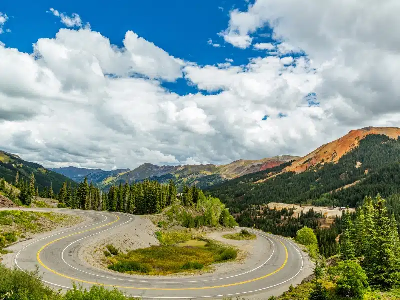 The San Juan Skyway forms a 233 mile loop in southwest Colorado traversing the heart of the San Juan Mountains featuring breathtaking mountain views and includes the portion of US 550 between Silverton and Ouray known as the Million Dollar Highway.