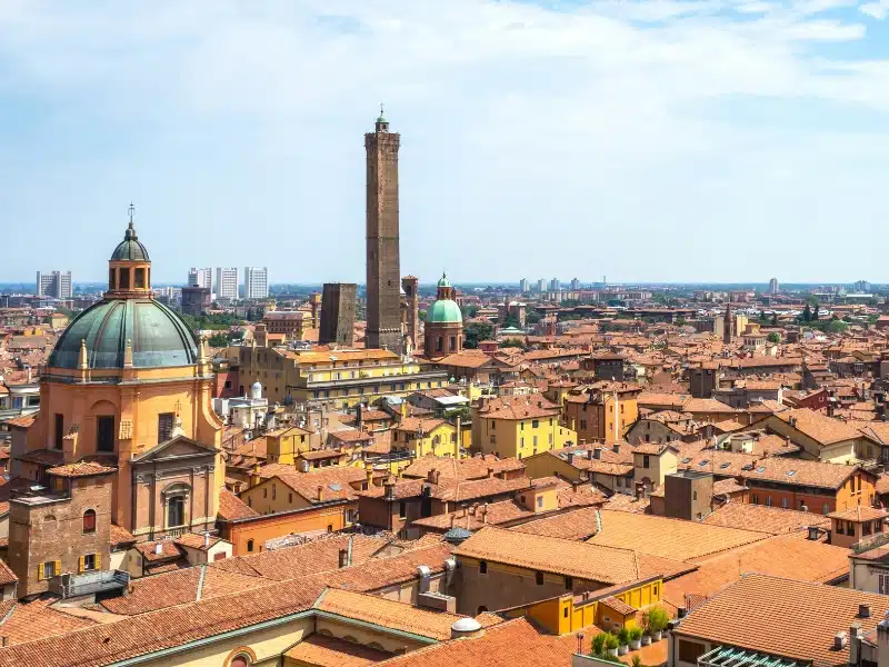 Terracotta roofs with tall towers and verdi gris domes
