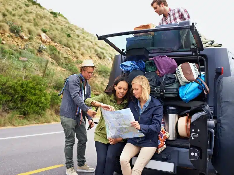 A group of young friends preparing for their road trip.