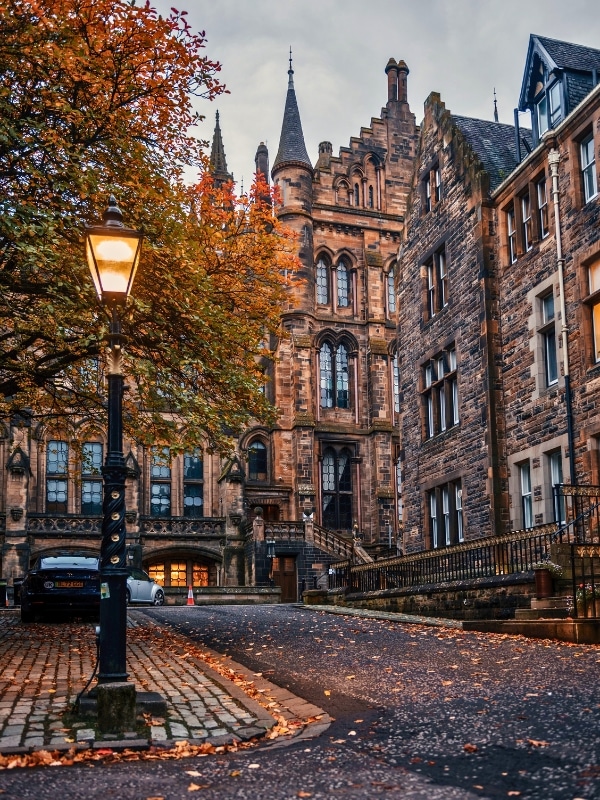 Glasgow, the UK, Lit Lamp and Historic Buildings at Glasgow University