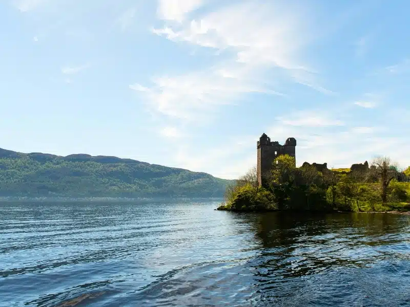 Castle ruins beside. alarge body of water