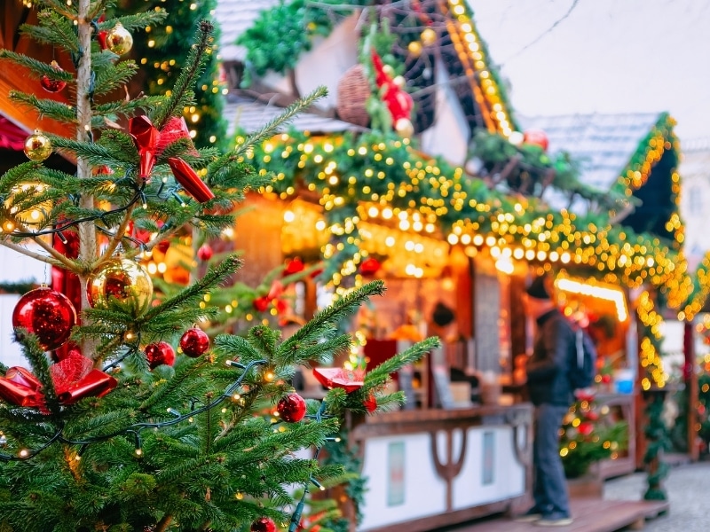 Christmas market stall with Chriatsmas tree, tinsel and baubales