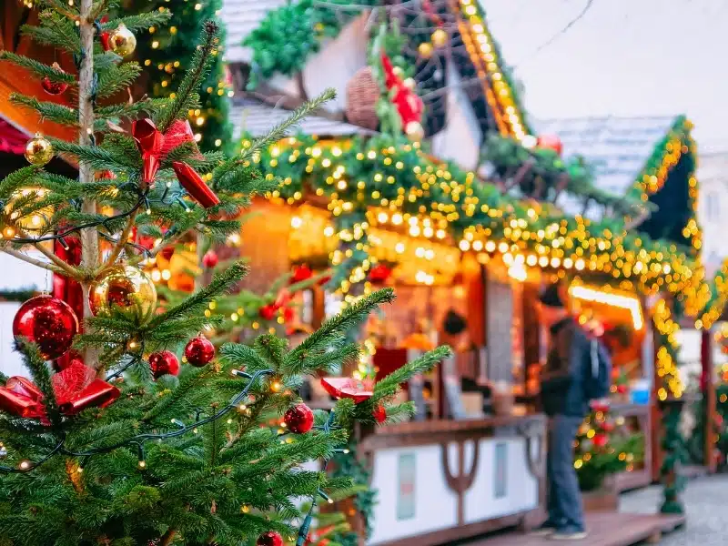 Christmas market stall with Chriatsmas tree, tinsel and baubales