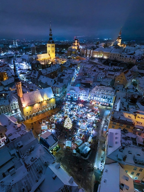 Medieval old town with uplit churches and a lively Christmas Market