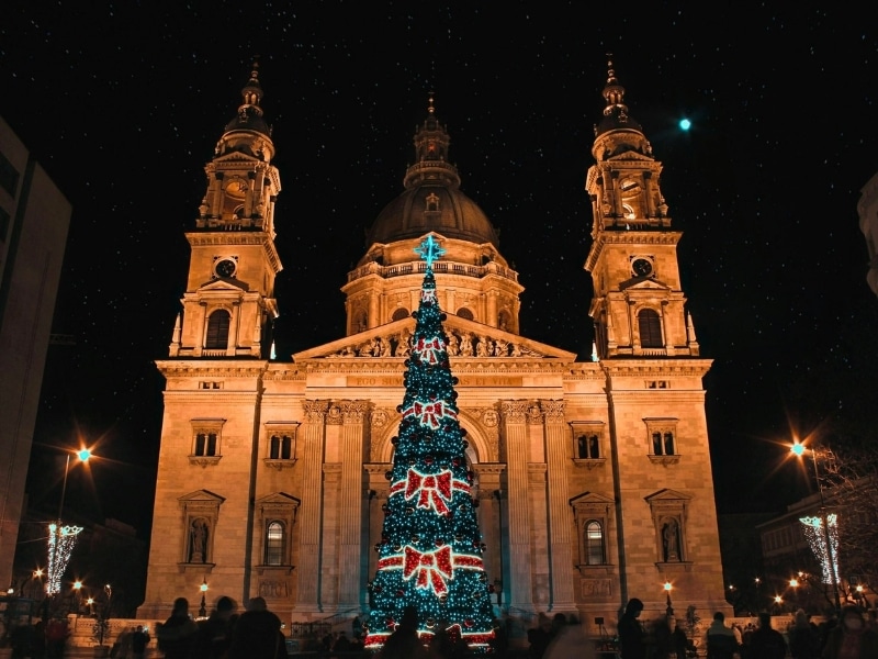 A stylistic Christmas tree decorated with red bows decorated the front of St. Stephen's Basilica in Budapest