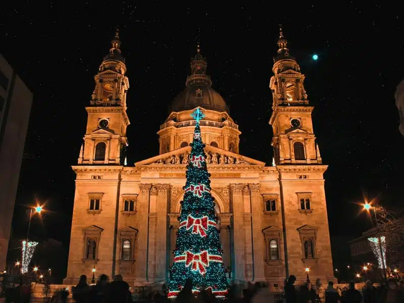 A stylistic Christmas tree decorated with red bows decorated the front of St. Stephen's Basilica in Budapest
