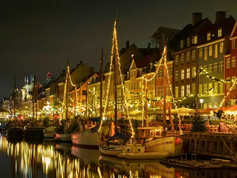 The boats, restauranr and hotels that line Nyhavn festooned with Christmas lights