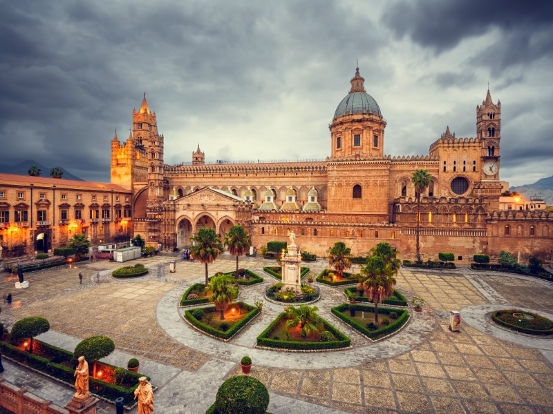 Ancient cathedral with large piazza on a stormy day