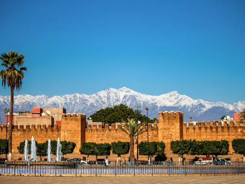 Medina walls with snow capped mountains in the distance
