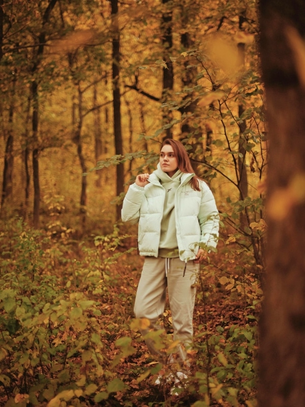 A woman dressed for comfort and warmth in the autumn forests of southern Germany