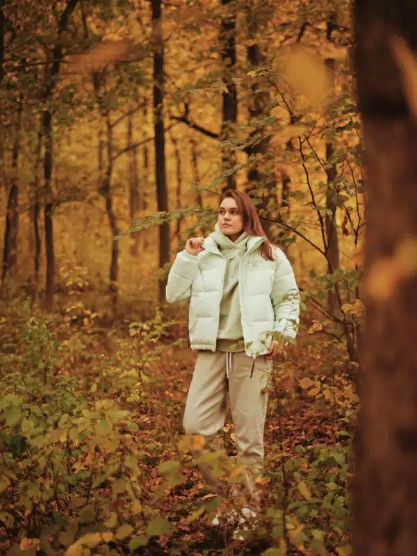 A woman dressed for comfort and warmth in the autumn forests of southern Germany