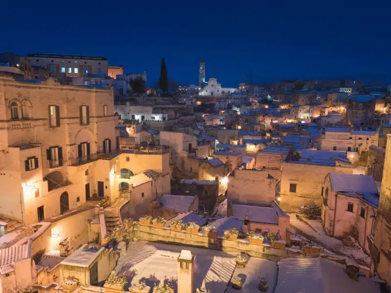 Scenic view of the "Sassi" district in Matera, in the region of Basilicata, in Southern Italy. Winter time, streets covered with snow
