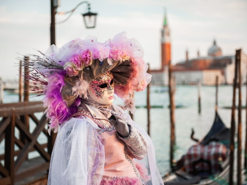 Beautiful colorful masks at traditional Venice Carnival in Venice, Italy