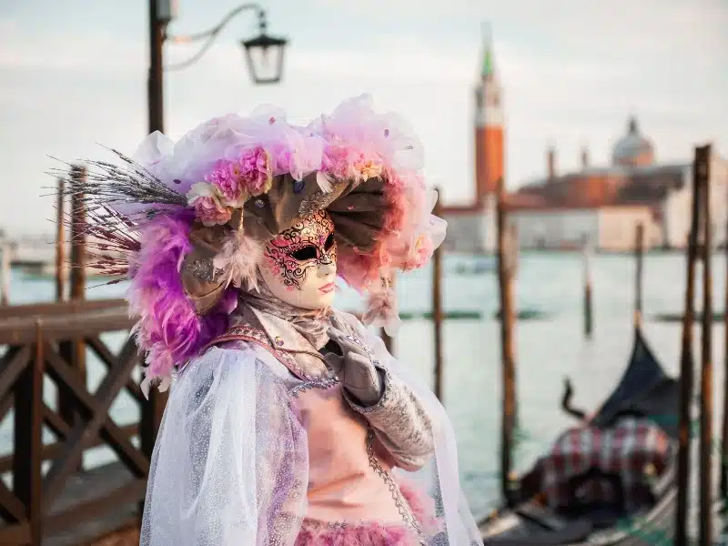 Beautiful colorful masks at traditional Venice Carnival in Venice, Italy