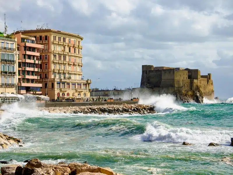 Storm waves on the medieval Castel  dell'Ovo (Egg castle) in Naples, Campania, Italy