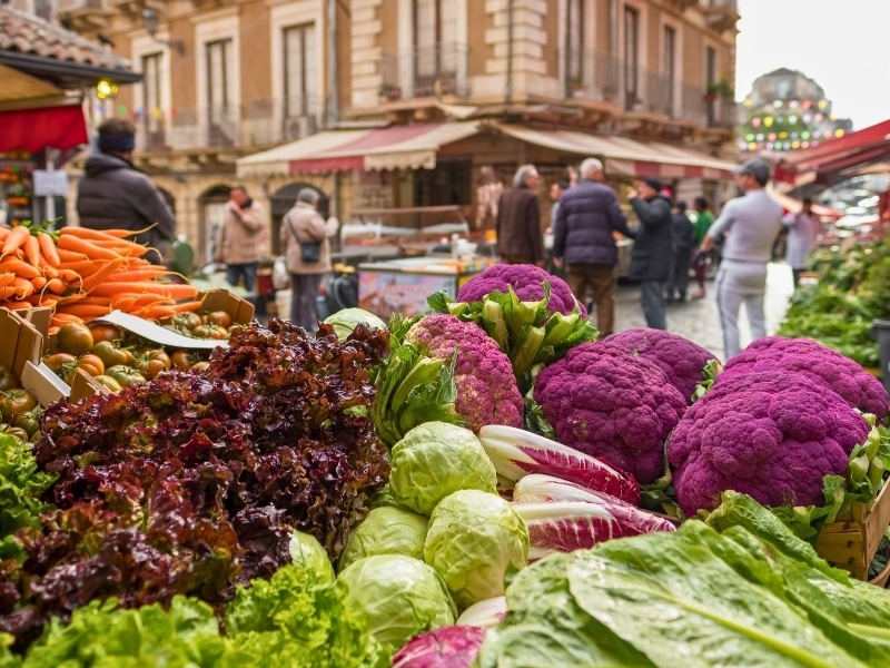 Fresh vegetables: cauliflower, salad, cabbage, carrot at famous Ballaro market in Palermo, Sicily, Italy