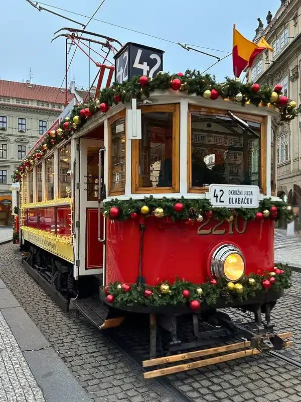Tradition tram decorated with christmas foliage and baulbale with a number 42 sign