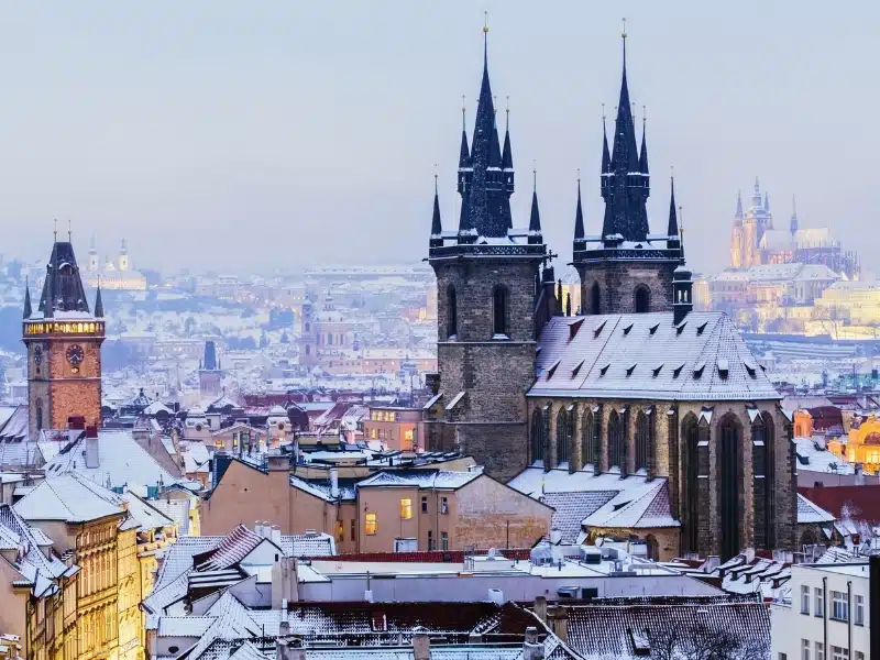 Winter in Prague - city panorama with Tyn Cathedral and Clock Tower. Prague, Bohemia, Czech Republic.