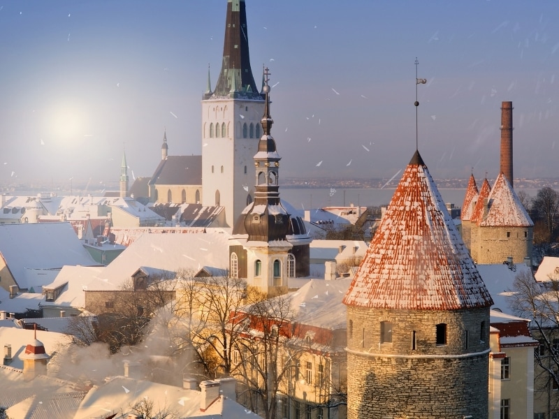 An amazing winter day eve Christmas in Tallinn - Estonia, panorama city during the snowfall, New Year background