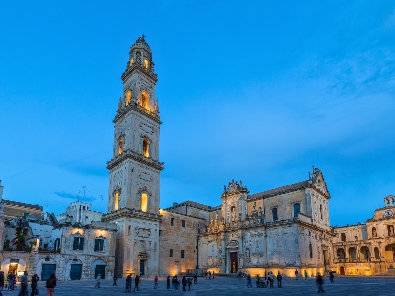 Lecce Cathedral seen from the Piazza del Duomo with the bell tower or campanile on an early winter's evening