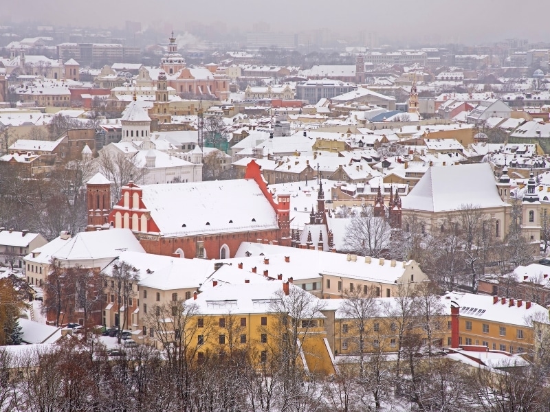Panoramic view of Vilnius in Lithuania in January when the snow is thick on the rooftops