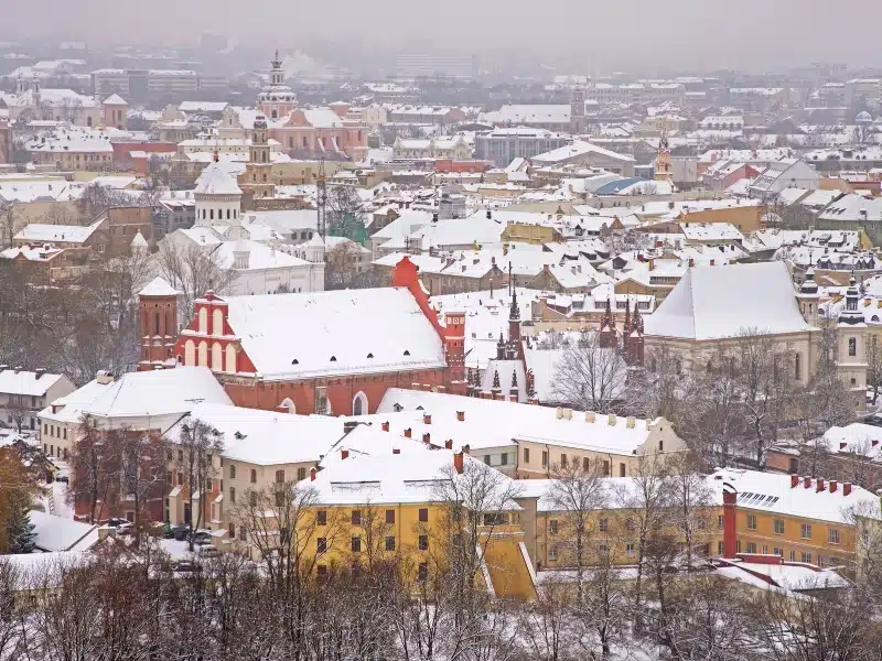 Panoramic view of Vilnius in Lithuania in January when the snow is thick on the rooftops