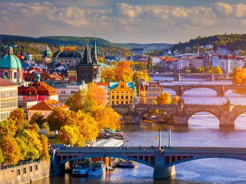 Autumn view to Charles Bridge, Prague old town and Vltava River from popular view point in the Letna Park 