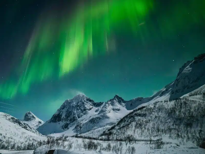 Breathtaking Illumination of Aurora Borealis in Mountains of Northern Norway near Tromso