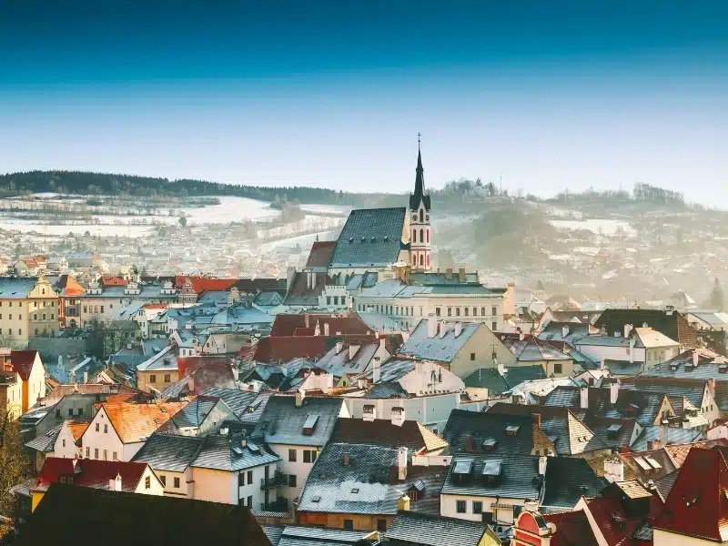 Panoramic view of Cesky Krumlov in winter, Czech Republic. View of the snow-covered red roofs. 