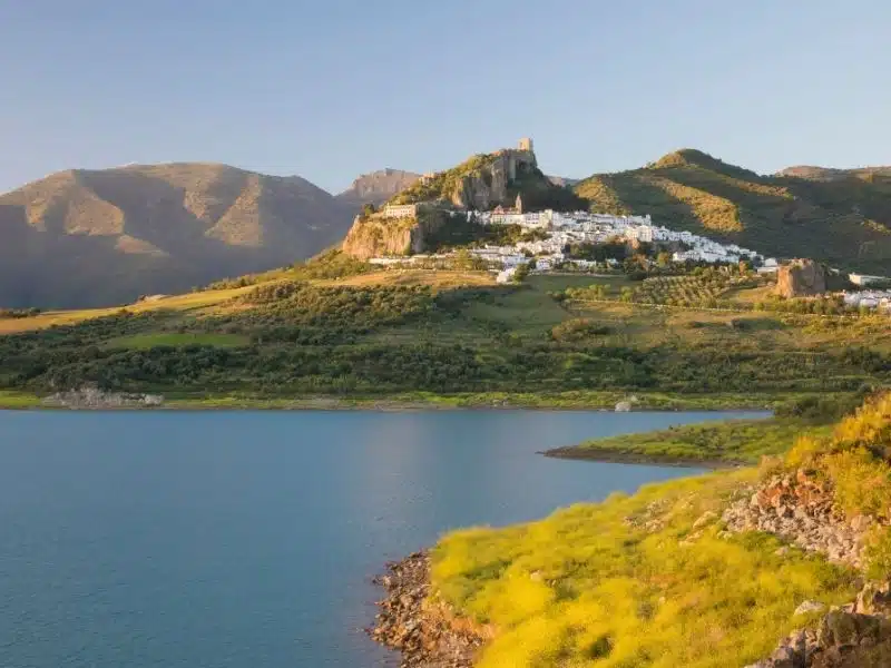 Moorish castle above white village and reservoir, Zahara de la Sierra, Sierra de Grazalema Natural Park, Andalucia, Spain, Europe
