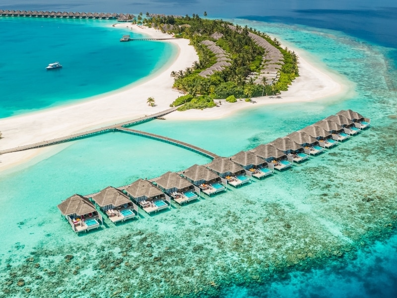 Perfect Maldives paradise scene. Tropical aerial landscape, seascape, luxury water villas. Amazing sea sky, reef lagoon beach picturesque nature.
