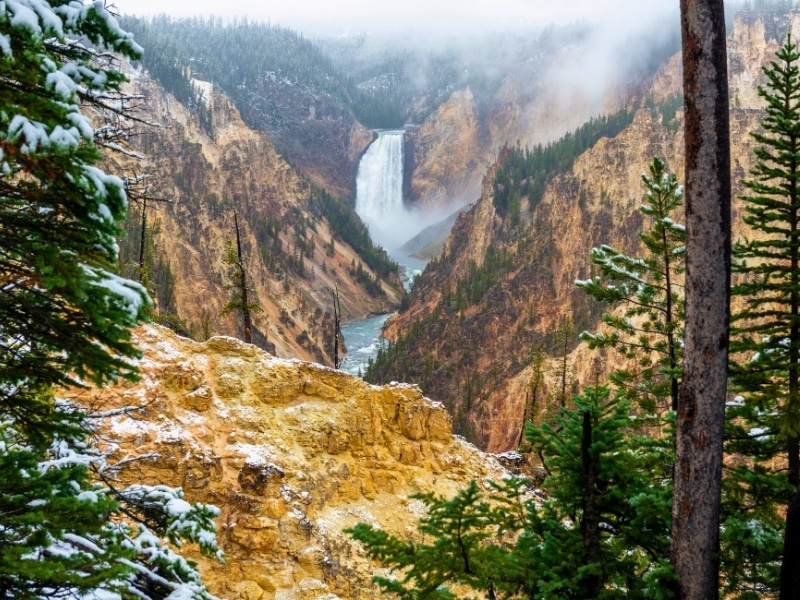 Lower Falls in the Grand Canyon of the Yellowstone with snow, Yellowstone national park, Wyoming, USA.