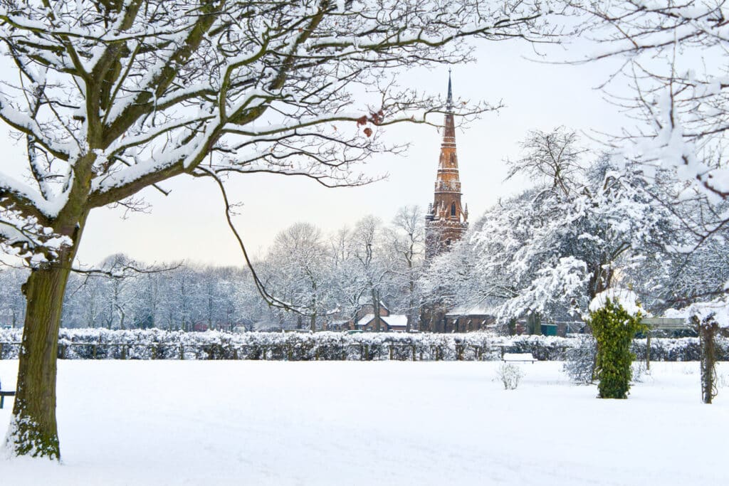 Platt Fields Park in Manchester UK covered with snow