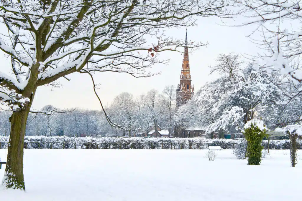 Platt Fields Park in Manchester UK covered with snow