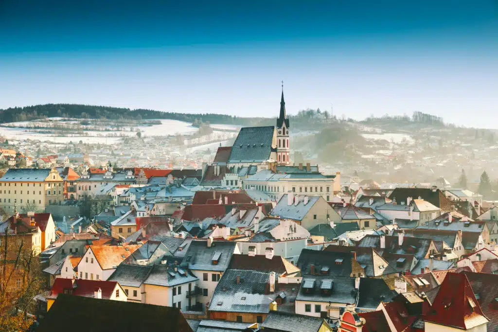 Panoramic view of Cesky Krumlov in winter, Czech Republic. View of the snow-covered red roofs. 