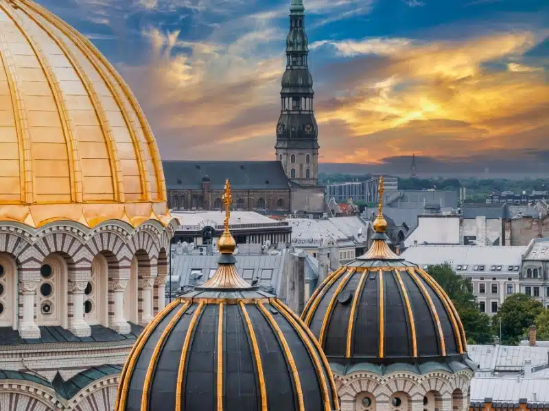 Byzantine-styled Orthodox cathedral, the largest in the Baltic region, with golden colored dome, polished gilded cupolas gleaming through the trees