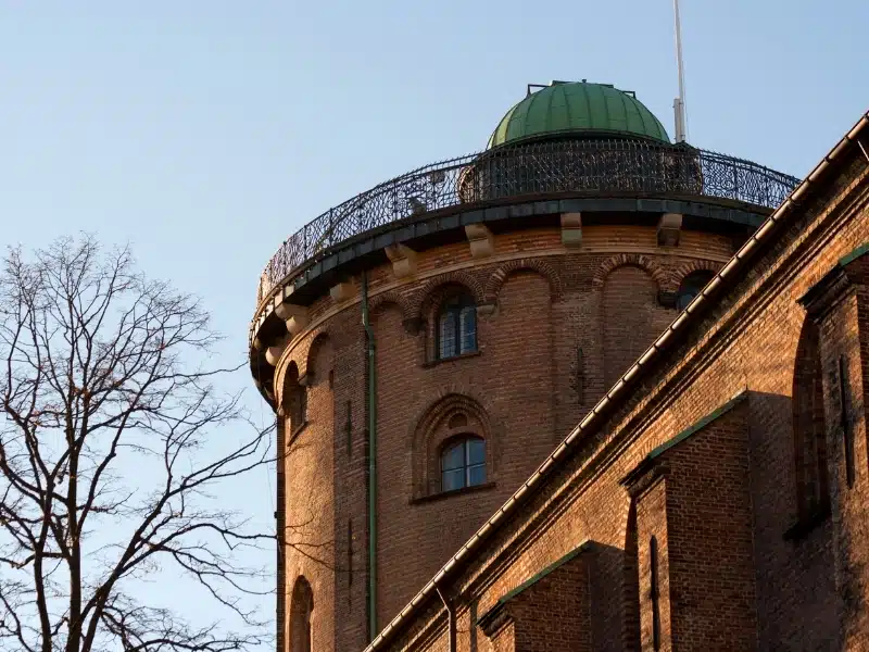 The top of the Round Tower (Rundetärn in Danish) illuminated by the setting winter sun.