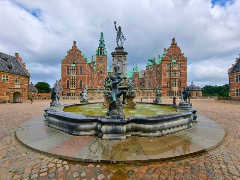 Neptune Fountain in front of the Frederiksborg Palace in Denmark on a wet winter's day