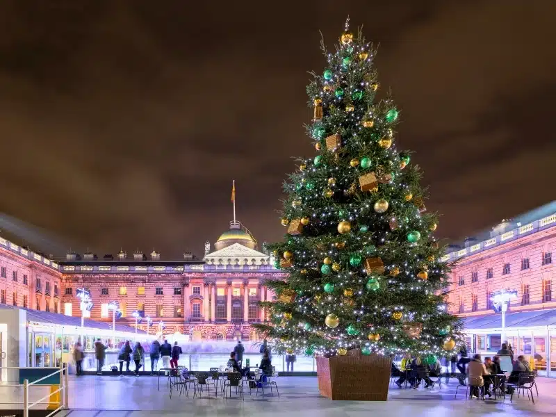The Somerset House in London with a christmas tree and ice rink in winter time