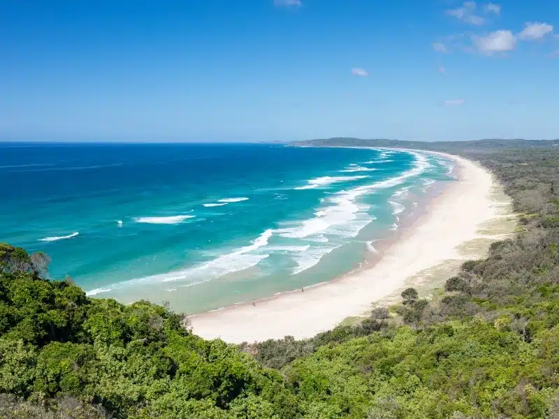 A famous view from Lighthouse Rd over Tallows Beach and Cape Byron in Byron Bay, New South Wales, Australia